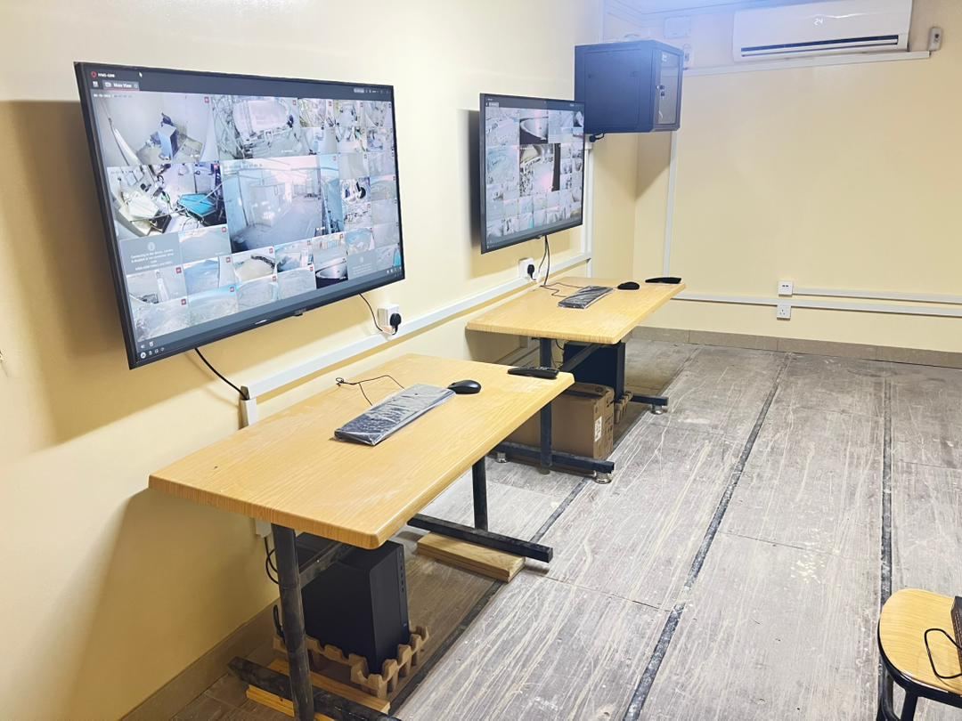 Monitoring room with live multi-camera feeds
